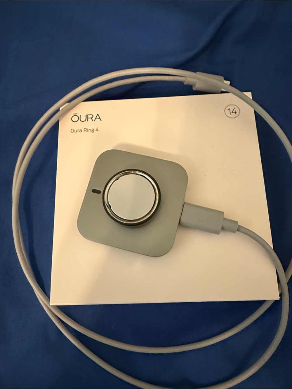 Oura Ring 4 and Charging Dock in Stealth Gray
